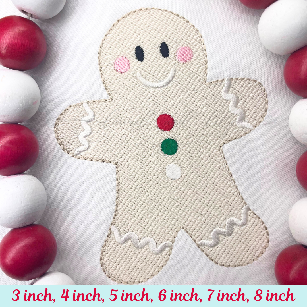 Embroidered gingerbread man design with colorful beads around on a white background